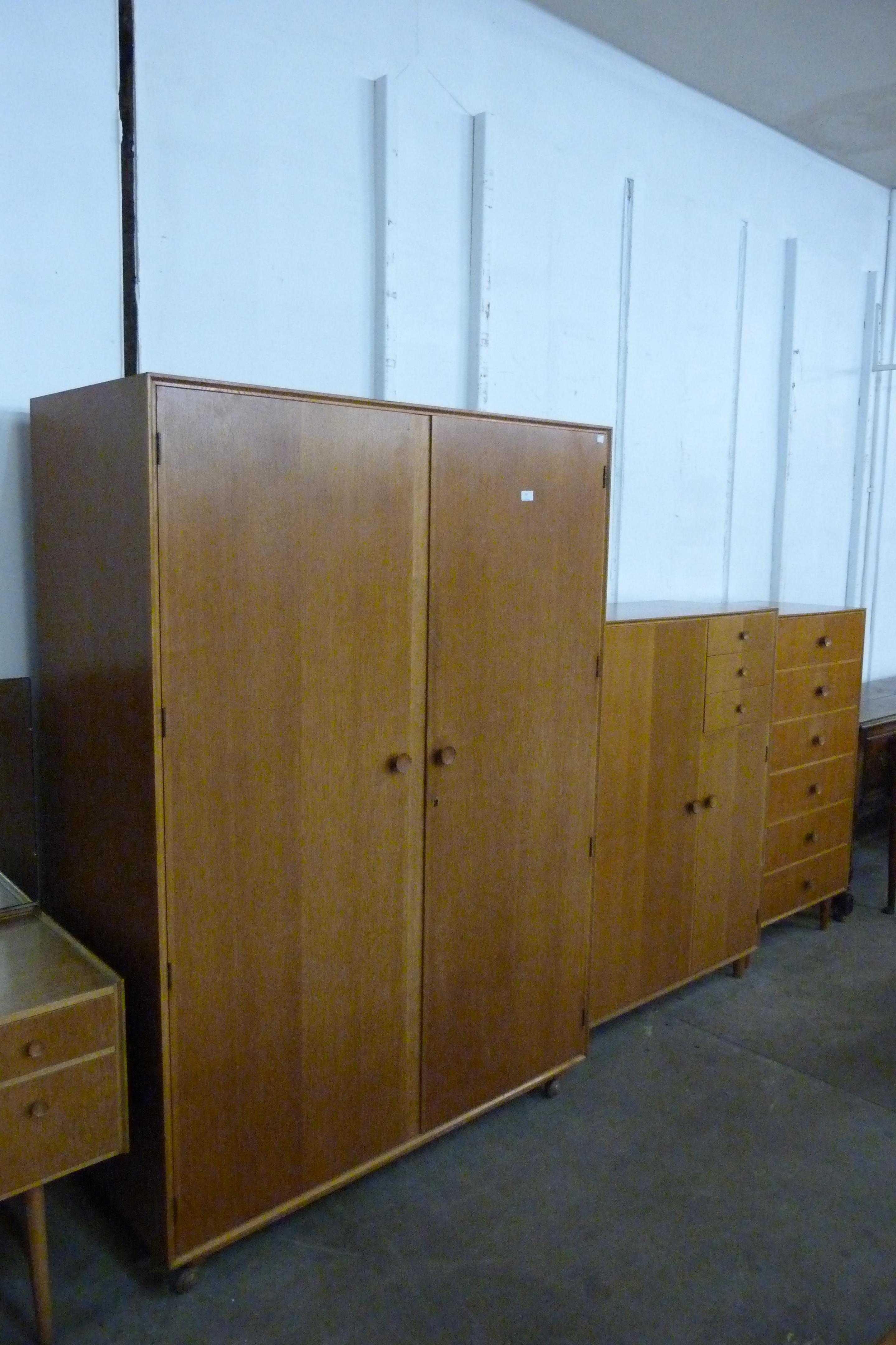 A Meredew oak four piece bedroom suite, comprising; wardrobe, tallboy, dressing table and a chest of - Image 3 of 5