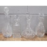Four crystal cut glass decanters