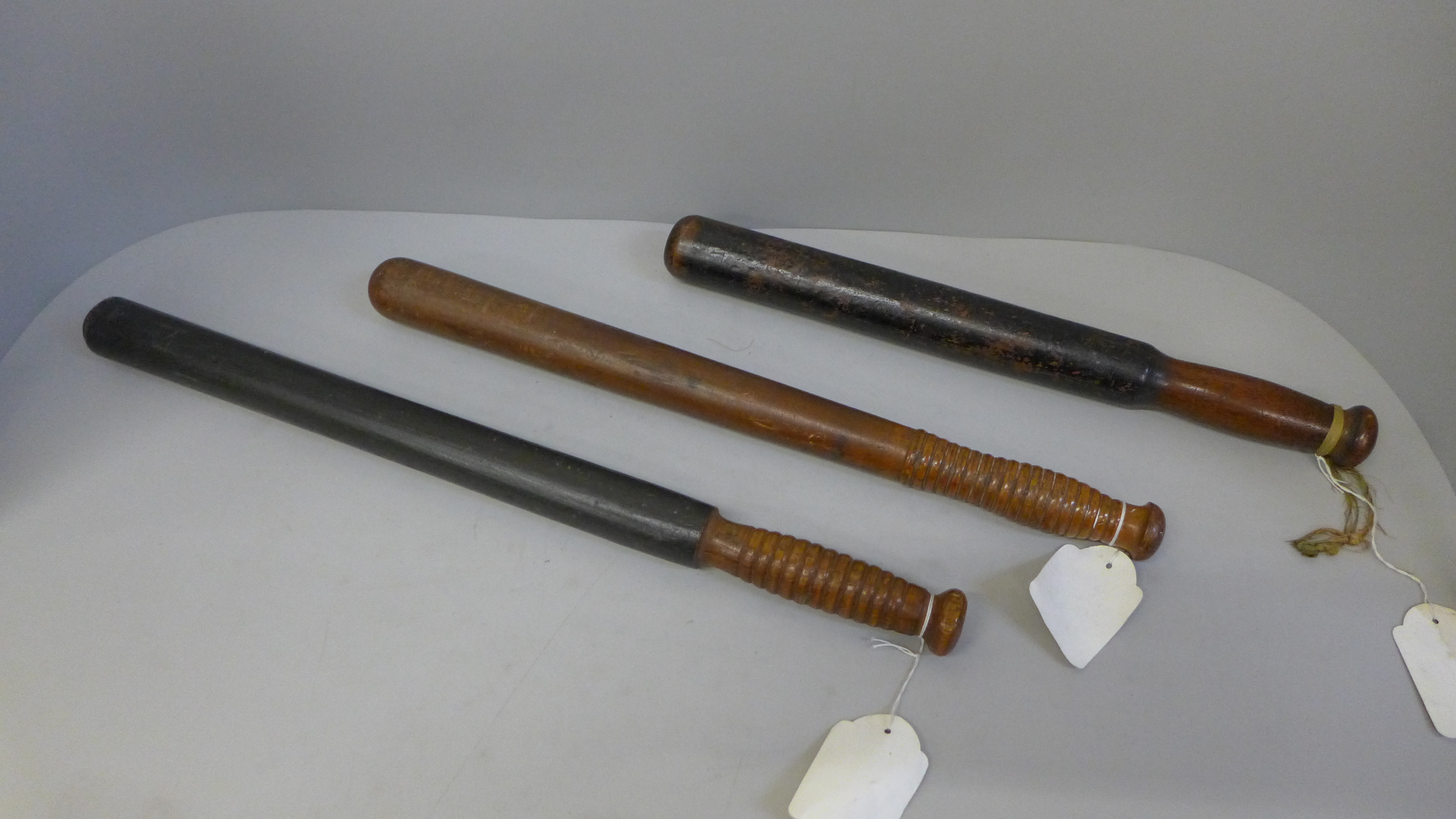 Three Victorian Police truncheons, Night Watchman pattern circa 1880, Field Packer type in light