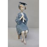 A Lladro figure of a Girl Graduate, 26.5cm