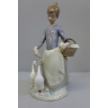 A Lladro figure, Pacing the Ducks, 25cm