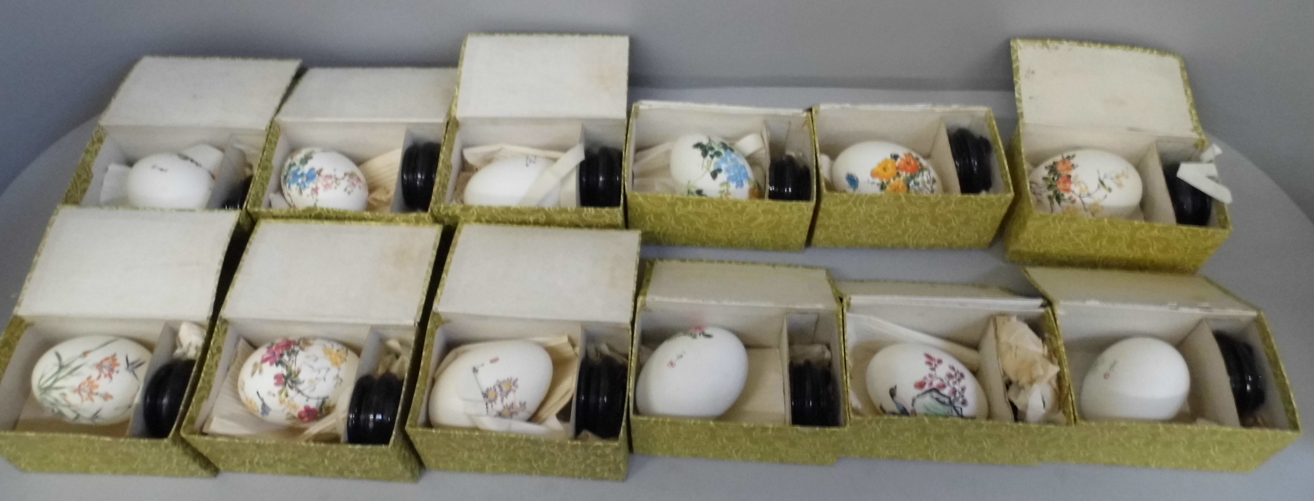 Three boxes of hand painted Chinese eggs and stands (18)