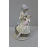 A Lladro figure of a Mother feeding her baby, 23cm