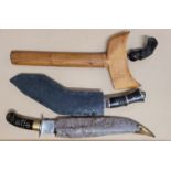 A kukri, a kris and one other dagger