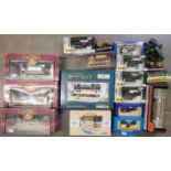 A collection of model trams, buses, traction engines and other model vehicles, boxed