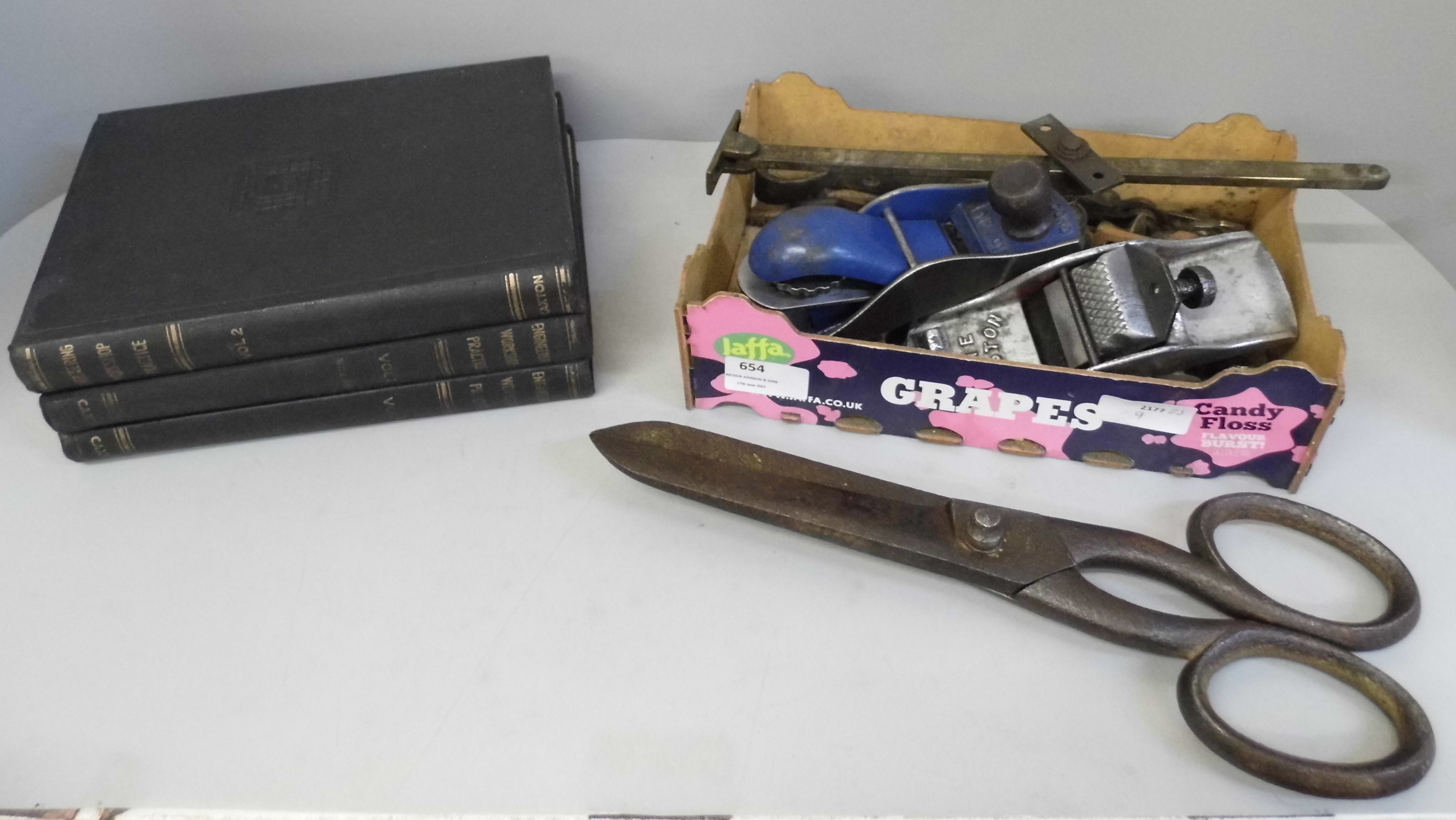 A large pair of scissors, 34cm, a collection of tools and three engineering books