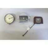 A Waltham car clock, one other made in U.S.A. and a Ford clock with Bakelite surround