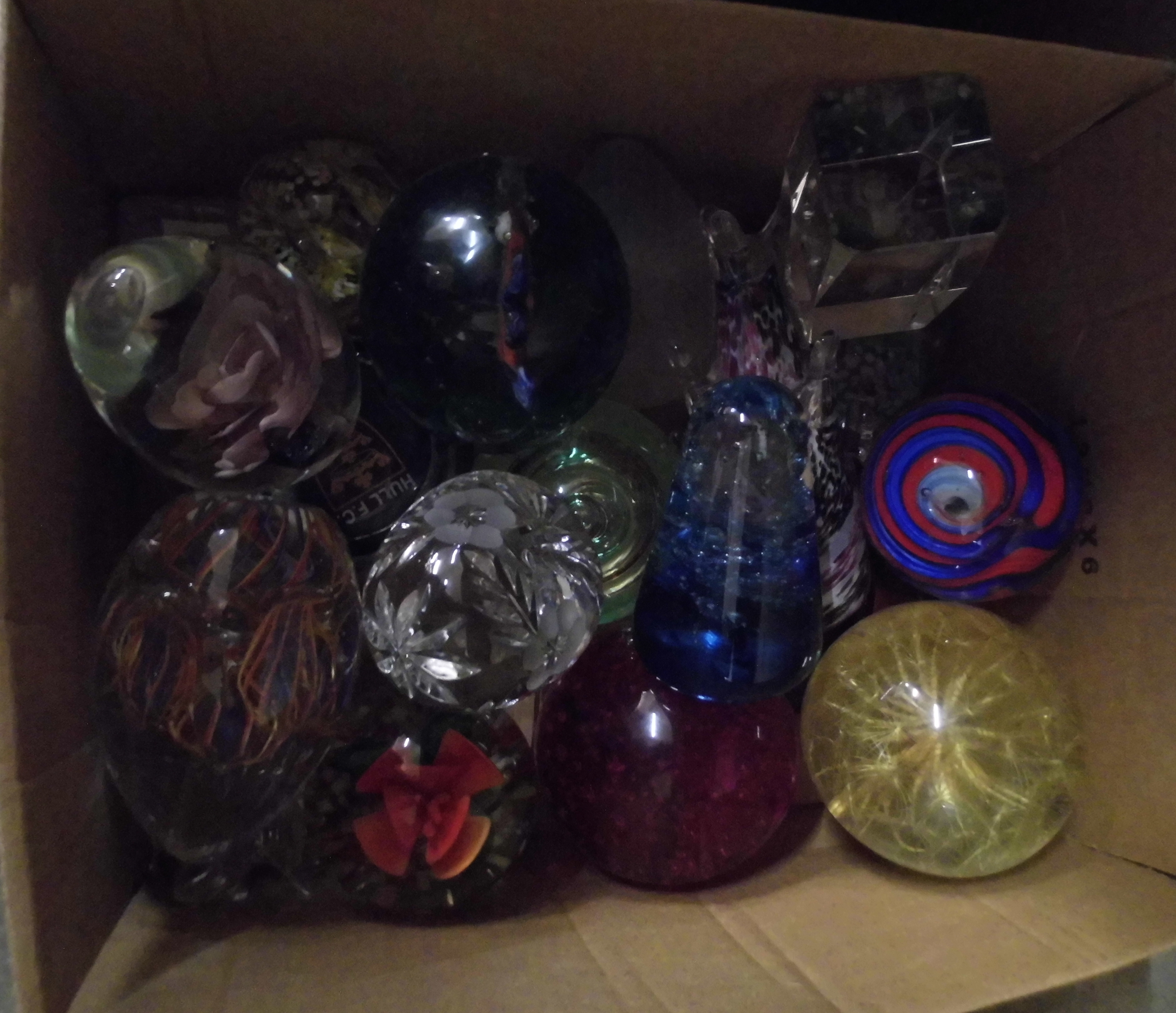 Twenty paperweights; nineteen glass and one acrylic