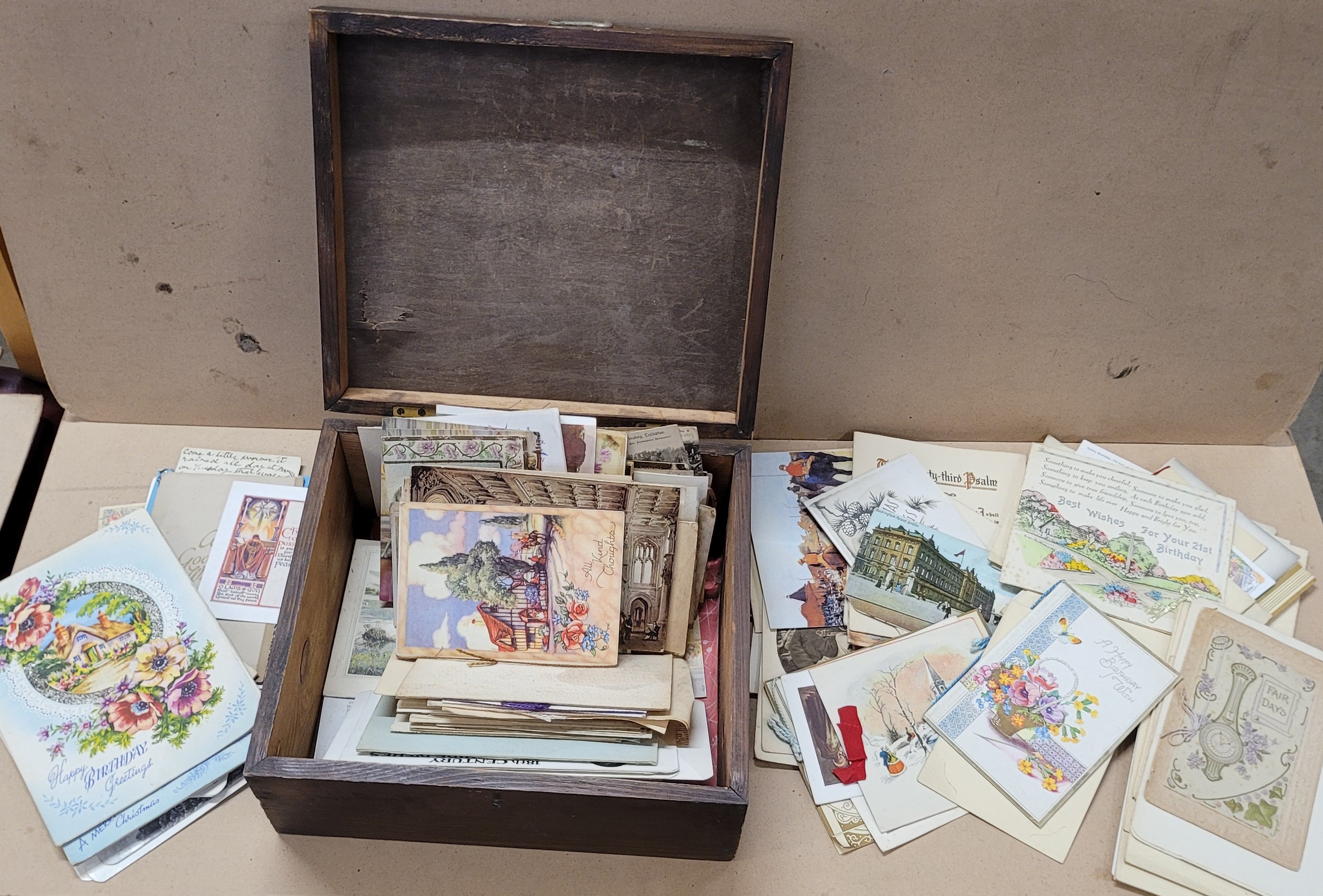 A box of Edwardian and later postcards and greetings cards