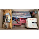 A pressed steel toy crane, a Mary Lou battery operated toy washing machine, three Kewpie dolls,