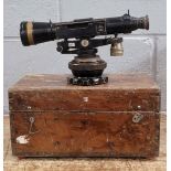 A military artillery gun sight, in wooden case
