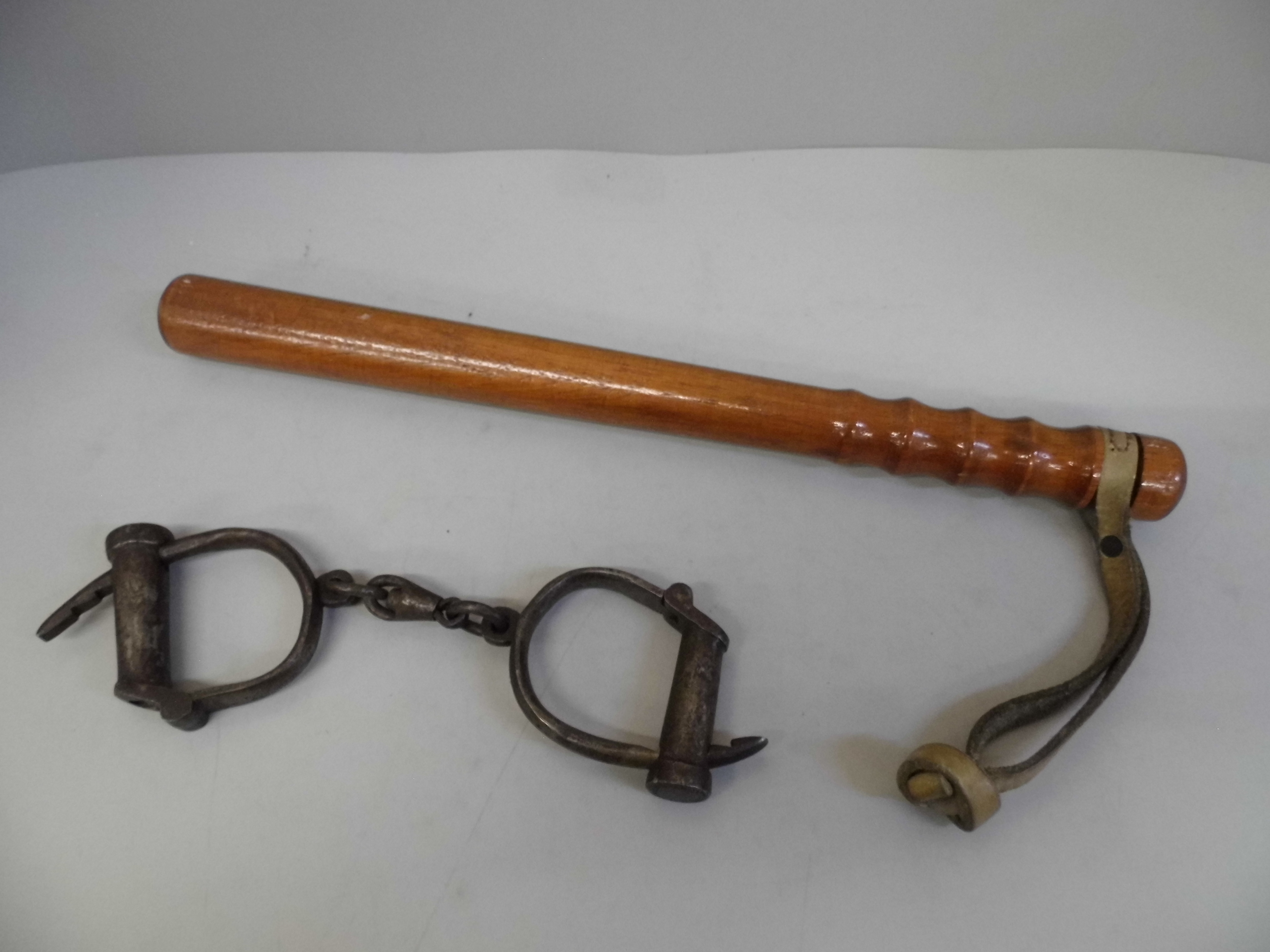 A wooden truncheon and a pair of handcuffs - Image 2 of 2