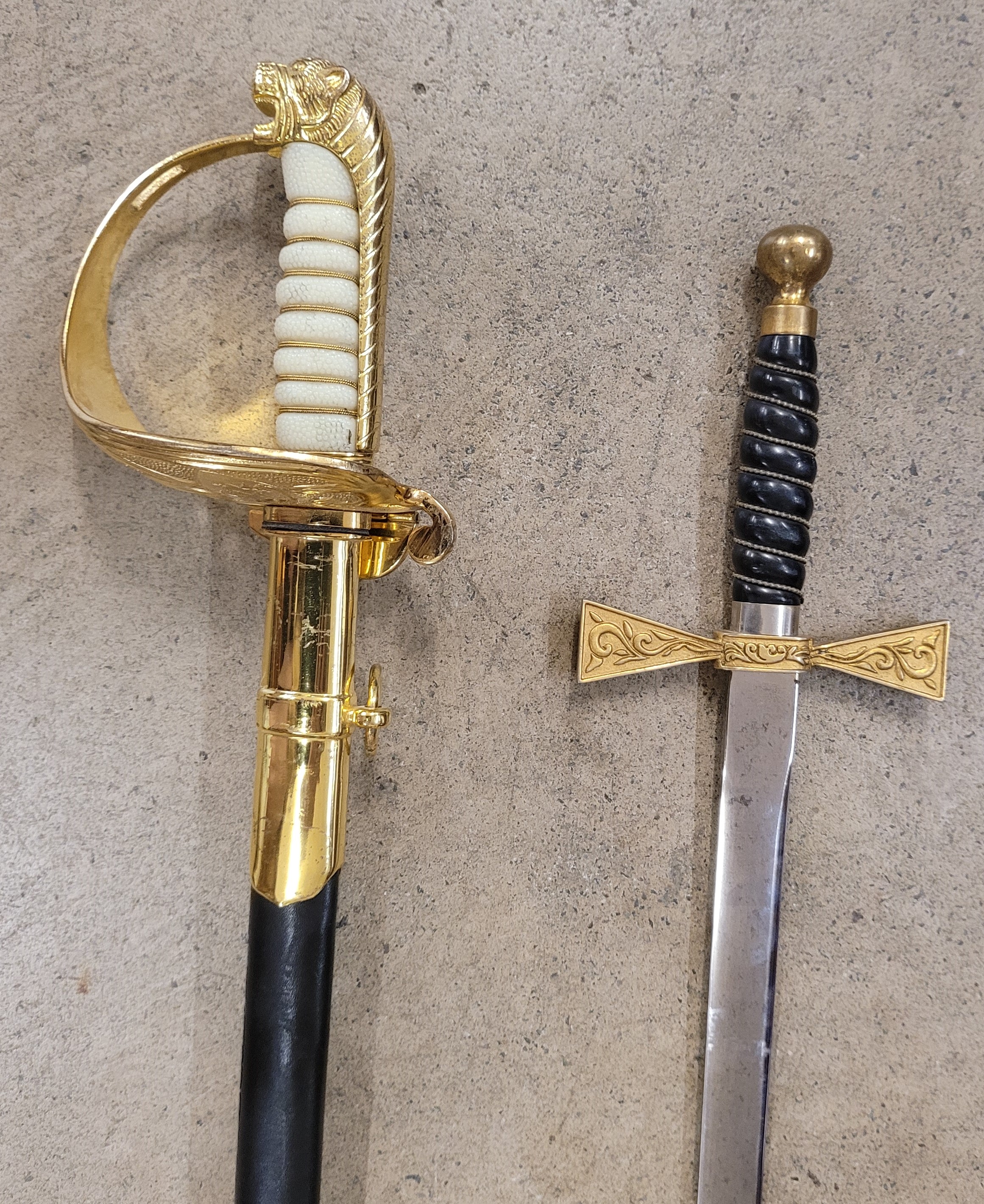 Two swords, one blade marked Wilkinson, possibly Masonic and one other sword