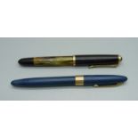 A Pelikan pen with 14k gold nib and a Sheaffer fountain pen with 14k gold nib