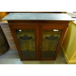 An Art Nouveau mahogany and stained glass bookcase top