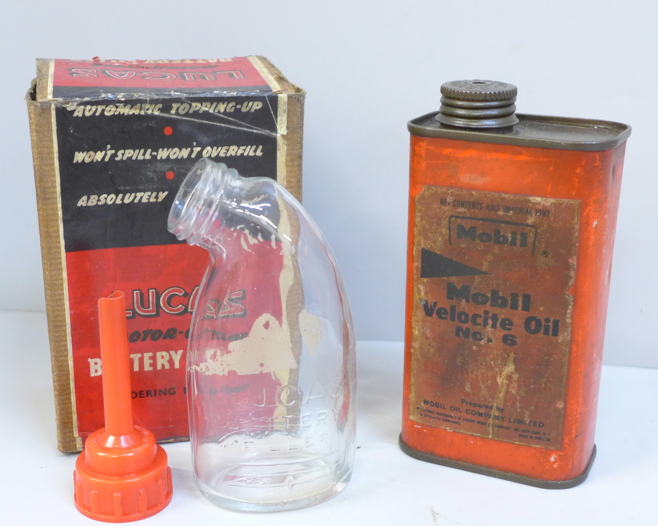 A Mobil oil can and a Lucas motor-cycle battery filler, in original box