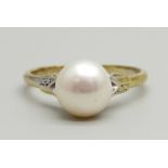 A silver gilt and pearl ring, R