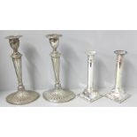 A pair of Parks of London silver plated candlesticks and one other pair of silver plated