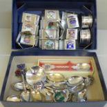 Fifteen napkin rings and fourteen spoons, all with various Coats of Arms