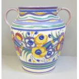 A Poole pottery vase, twin handles, decorated with leaves and flowers, one handle restored, 22.