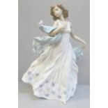 A Lladro figure of a woman with bird, Summer Serenade, 31.5cm