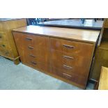 A teak chest of drawers