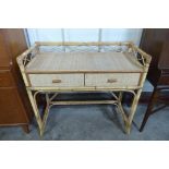 A bamboo and rattan two drawer desk