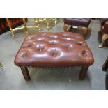 An oxblood red leather Chesterfield footstool