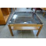 A Myer teak and glass topped square coffee table
