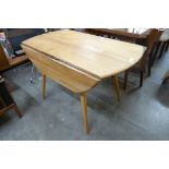 An Ercol Blonde elm and beech drop leaf table