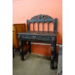A Victorian Jacobean Revival carved oak green man single drawer hall table