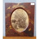 A Japanese Meiji Period red lacquered picture frame