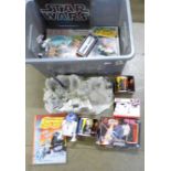 A large box of Star Wars toys and merchandise