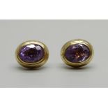 A pair of 9ct gold and amethyst ear studs, with butterflies marked 14k, 2.7g