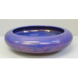 A Moorcroft purple/blue lustre shallow bowl, 20.5cm