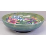 A Moorcroft Orchid pattern bowl, crazed, 27cm