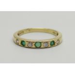 A 14k gold, emerald and zircon ring, 2.6g, O