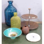 A small Poole pottery vase, a studio pottery bowl, a large blue glass bottle, a cake stand, etc.