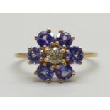 A 10k gold, iolite and white stone cluster ring, central stone loose in setting, 2.6g, U