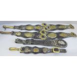Four items of horse brass tackle, two leather straps with Deighton Saddler Methuen brass plaques,