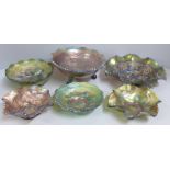 Six items of iridescent carnival glass, all decorated with grapes and vines including Fenton and