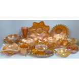 Sixteen items of orange carnival glass including a Northwood Wishbone bowl **PLEASE NOTE THIS LOT IS