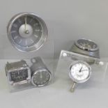 Two car clock displays mounted in Perspex, includes Jaeger and Smiths