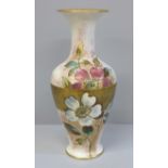 A Doulton Christmas Rose faience vase, registration lozenge to base, 19.5cm