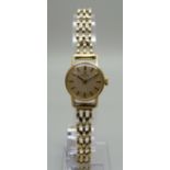A lady's 9ct gold Omega wristwatch with gold strap, 15g gross weight