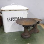 An enamel bread bin and a set of kitchen scales and weights