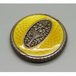A white metal and yellow guilloche enamel compact, small area of wear to the enamel near hinge
