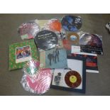 A collection of picture disc LP and 7" records, a signed LP record, REM, and other music tour