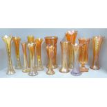 A collection of thirteen carnival glass vases in marigold **PLEASE NOTE THIS LOT IS NOT ELIGIBLE FOR