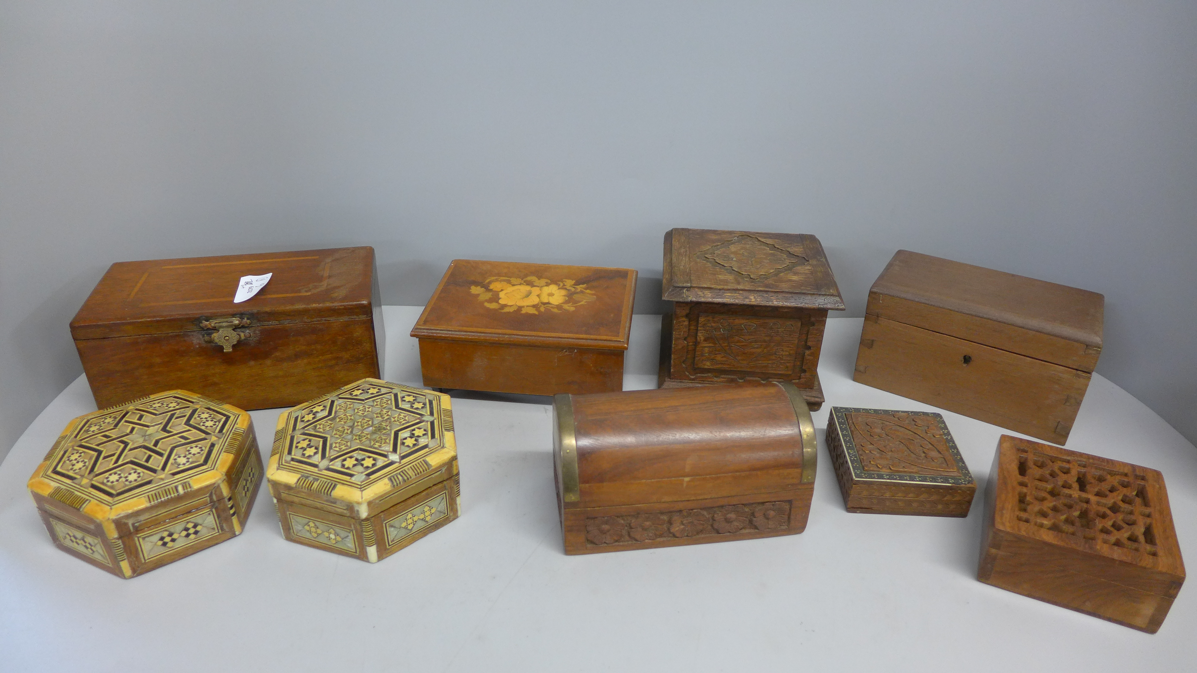 Nine decorative carved and inlaid wooden boxes